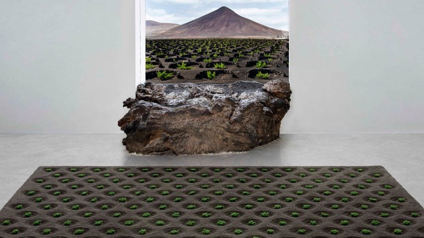 Rug with hand-tufted green plants set on top of a black backdrop