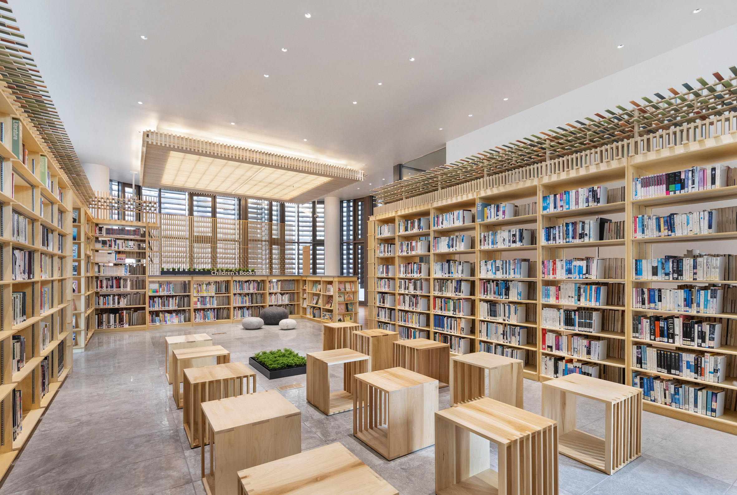 Library with cube-shaped stools for visitors to sit and read