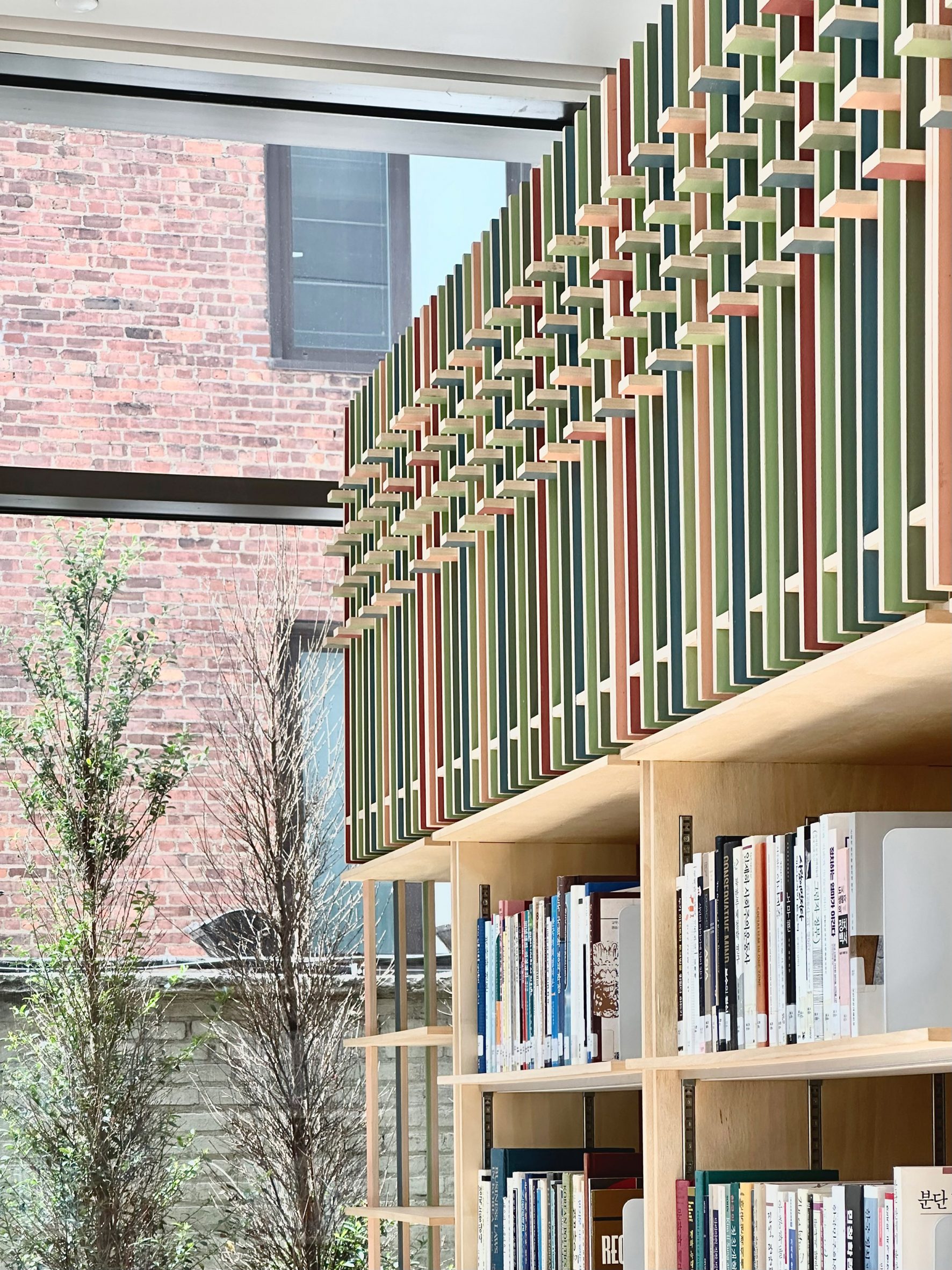 Coloured tops of a bookshelf