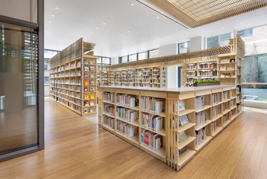 Library with a children section housed within a lower storage module