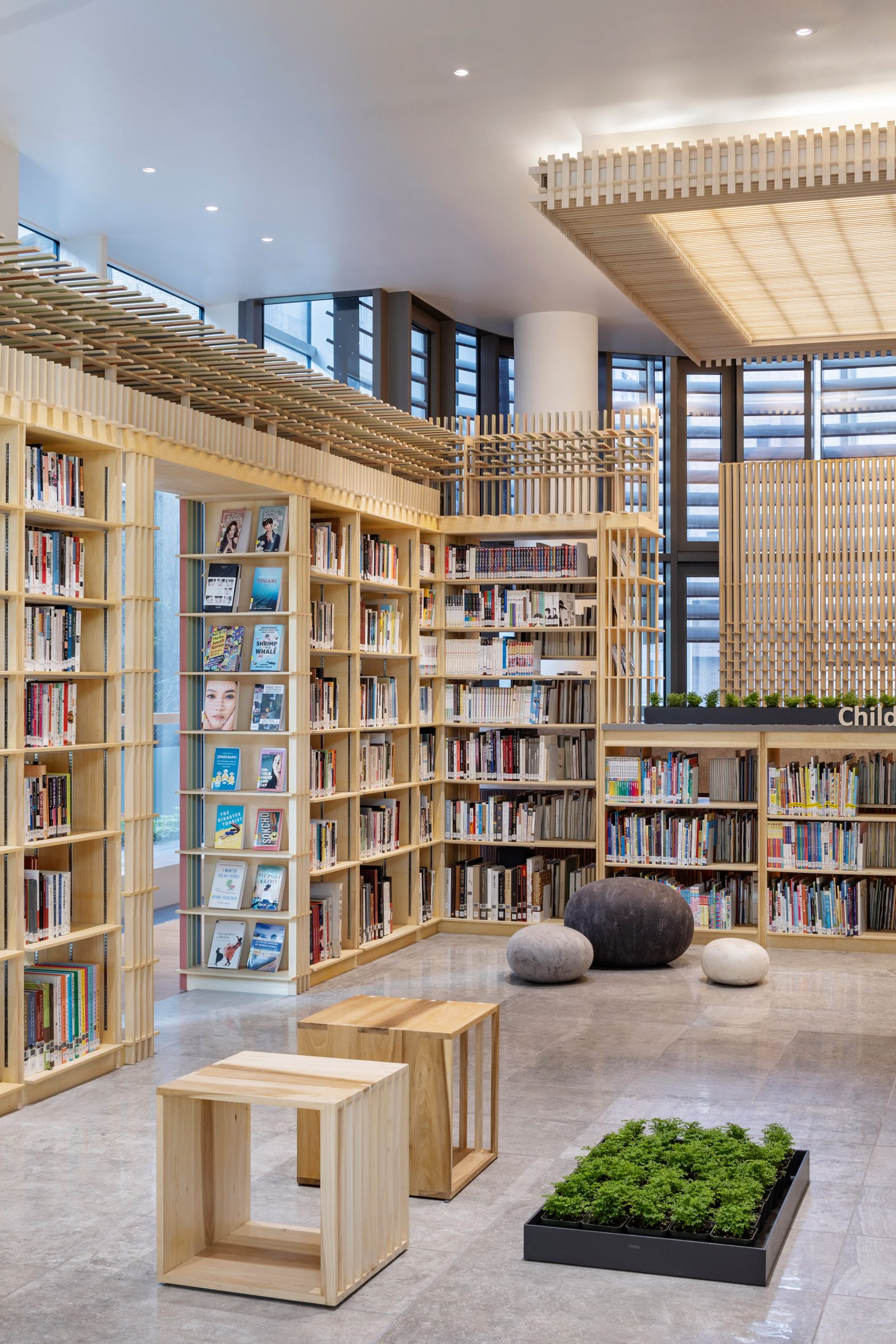 Library with wooden bookshelves around a central courtyard