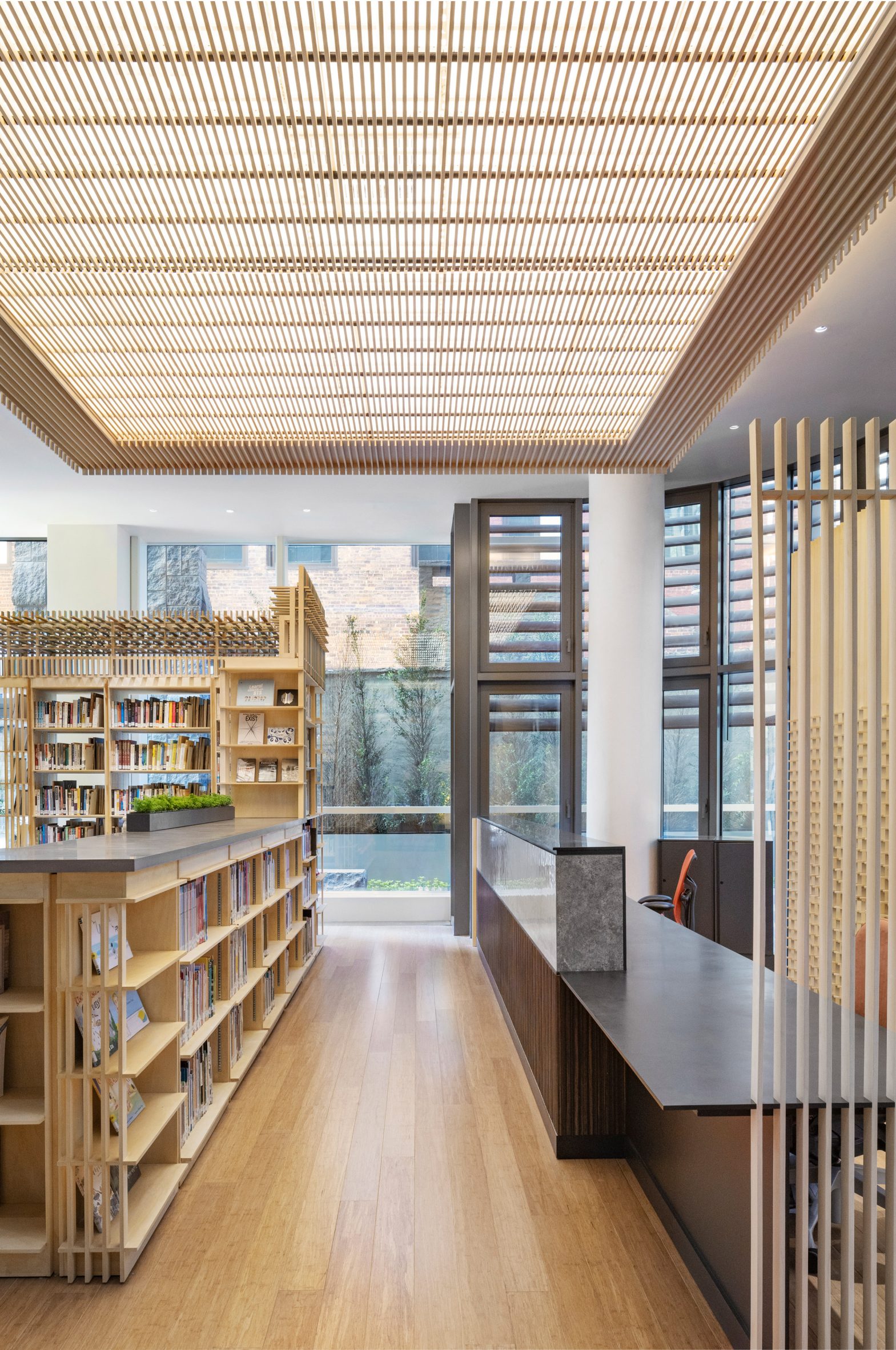 Wooden latticework installed across a ceiling and behind a reception desk