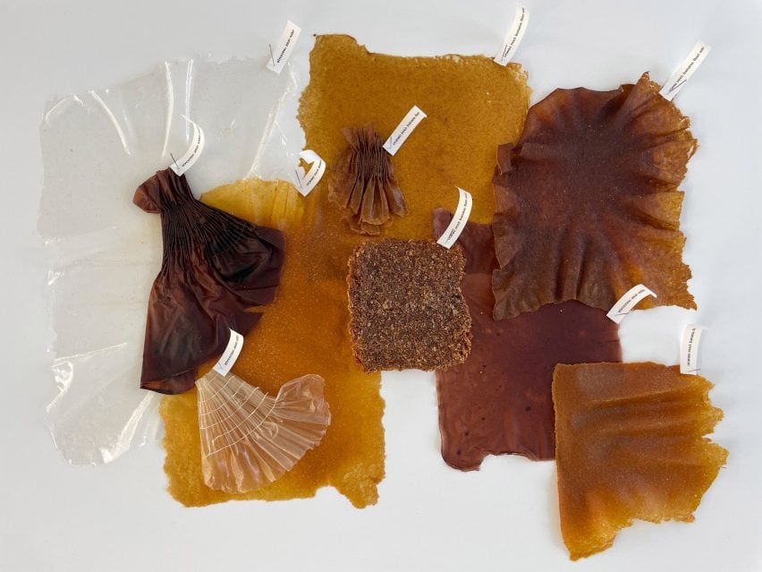 A photograph of a collection of natural materials in tones of brown and orange, against a white backdrop.