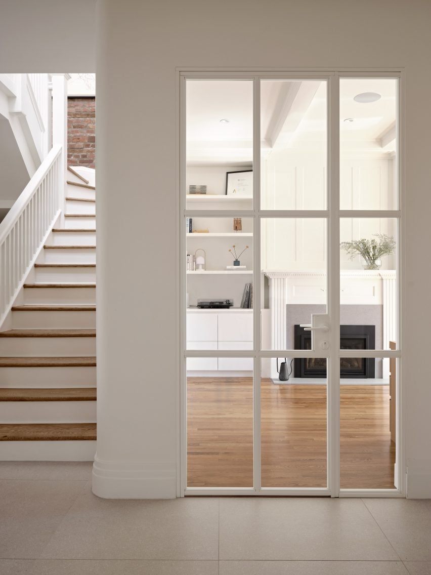 View through a glass and steel door into a home office