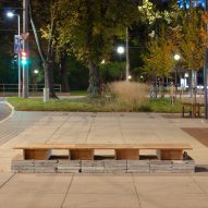 Wooden bench adjacent to No Time to Waste pavilion