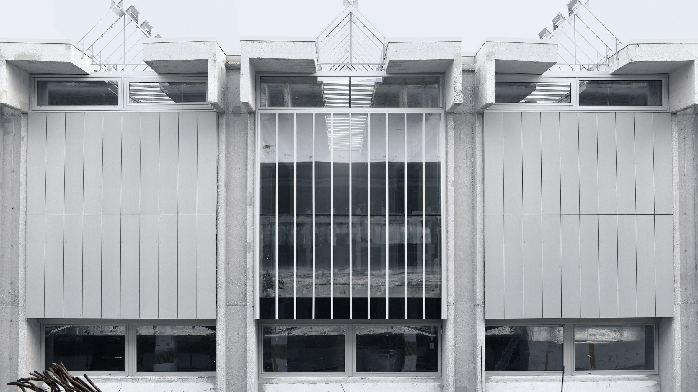 Exterior view of brutalist office building by OFIS Arhitekti