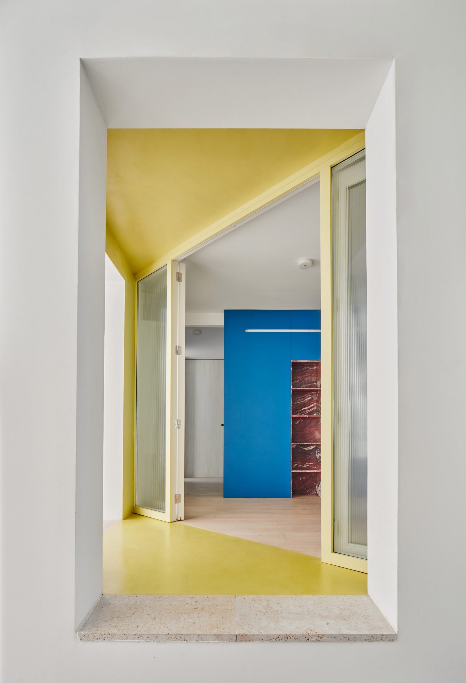 Yellow paint frames the entrance hall