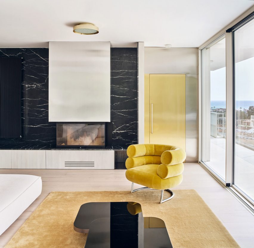 Living area with yellow chairs