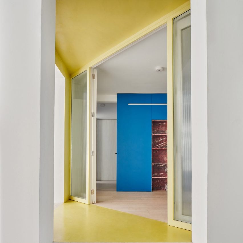 Yellow entranceway by Raúl Sánchez Architects