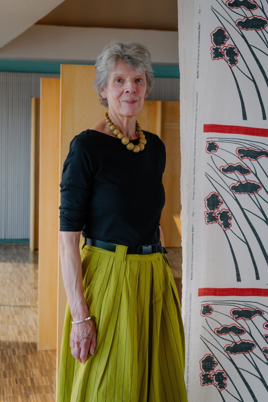 Paula Day in front of patterned fabric by Lucienne Day