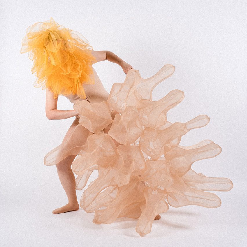 a photograph of a person wearing an abstract fashion garment