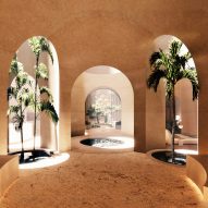 Warm and earthy-toned underground interior with palm trees