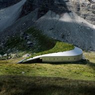 Snøhetta designs hikers' refuge in Pyrenees mountains with swooping grass roof