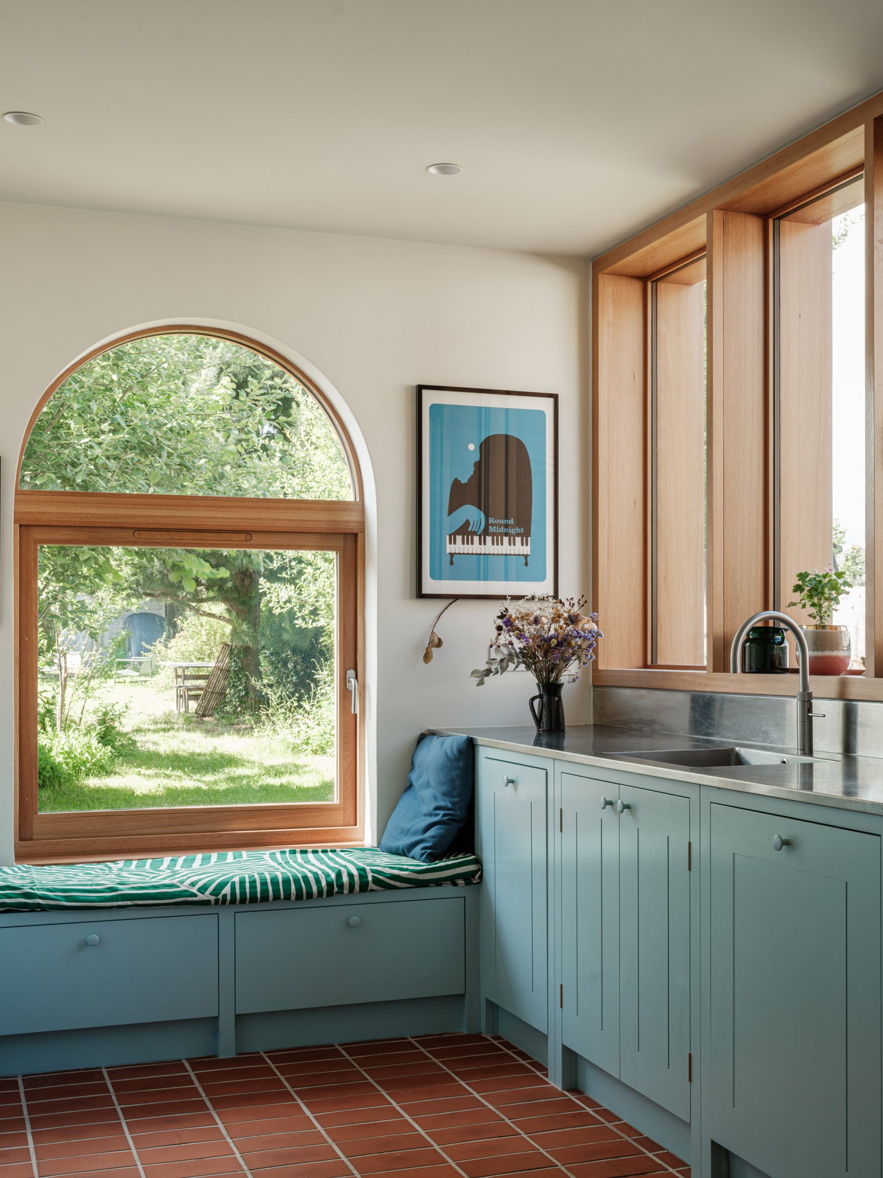 Wood framed window and seat in kitchen