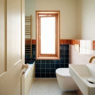 Colourful bathroom tiles in blue and orange