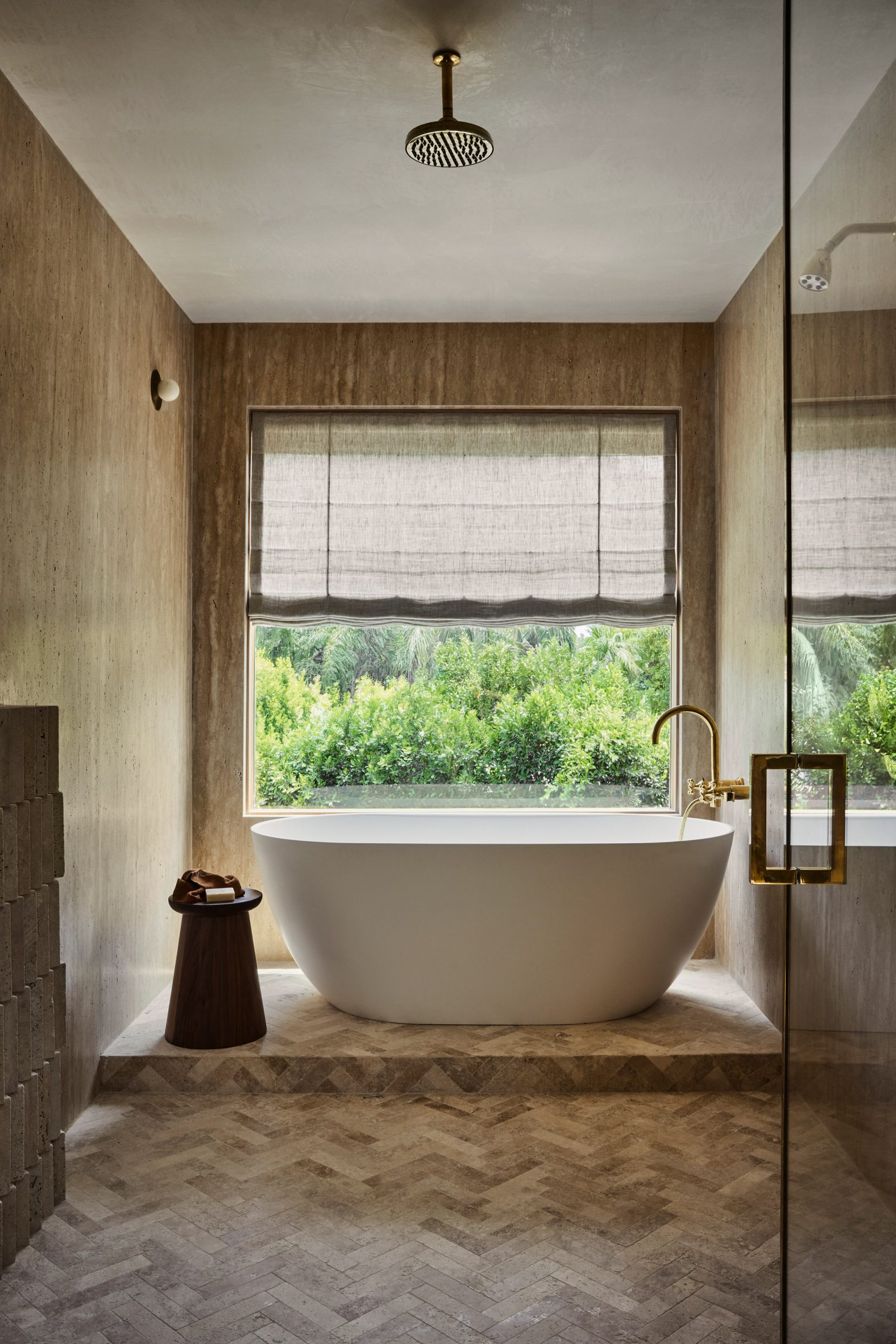 Travertine covers the walls in a bathroom