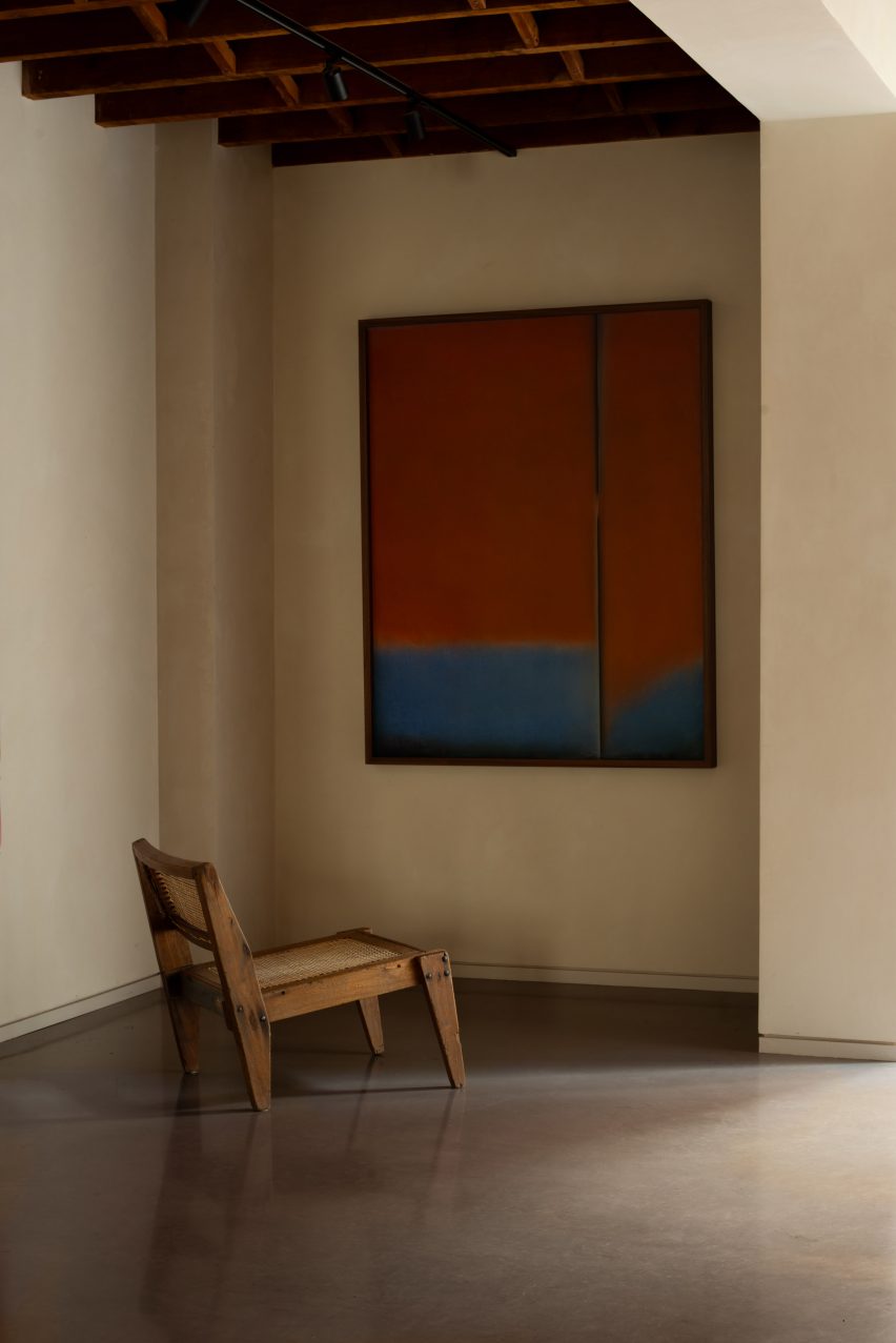 chair in front of painting