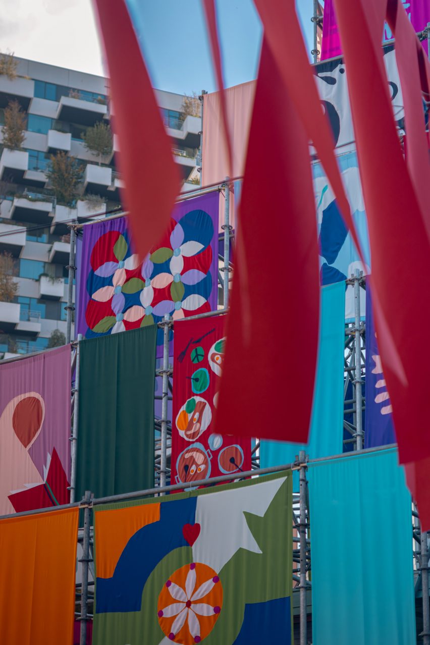 Colourful flags hanging on the Temple of Peace by Peace Seekers at Dutch Design Week 2024