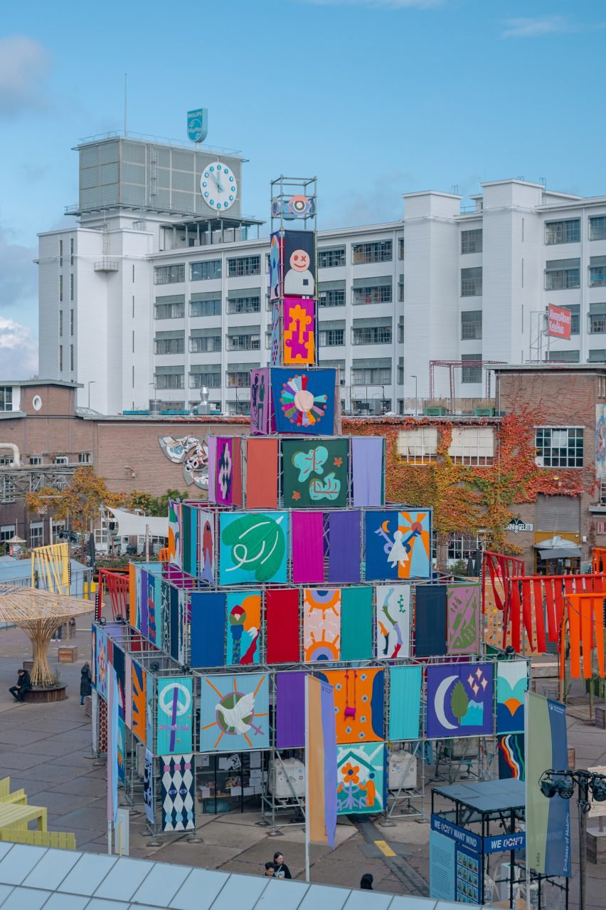 Pyramid made from scaffolding and colourful flags