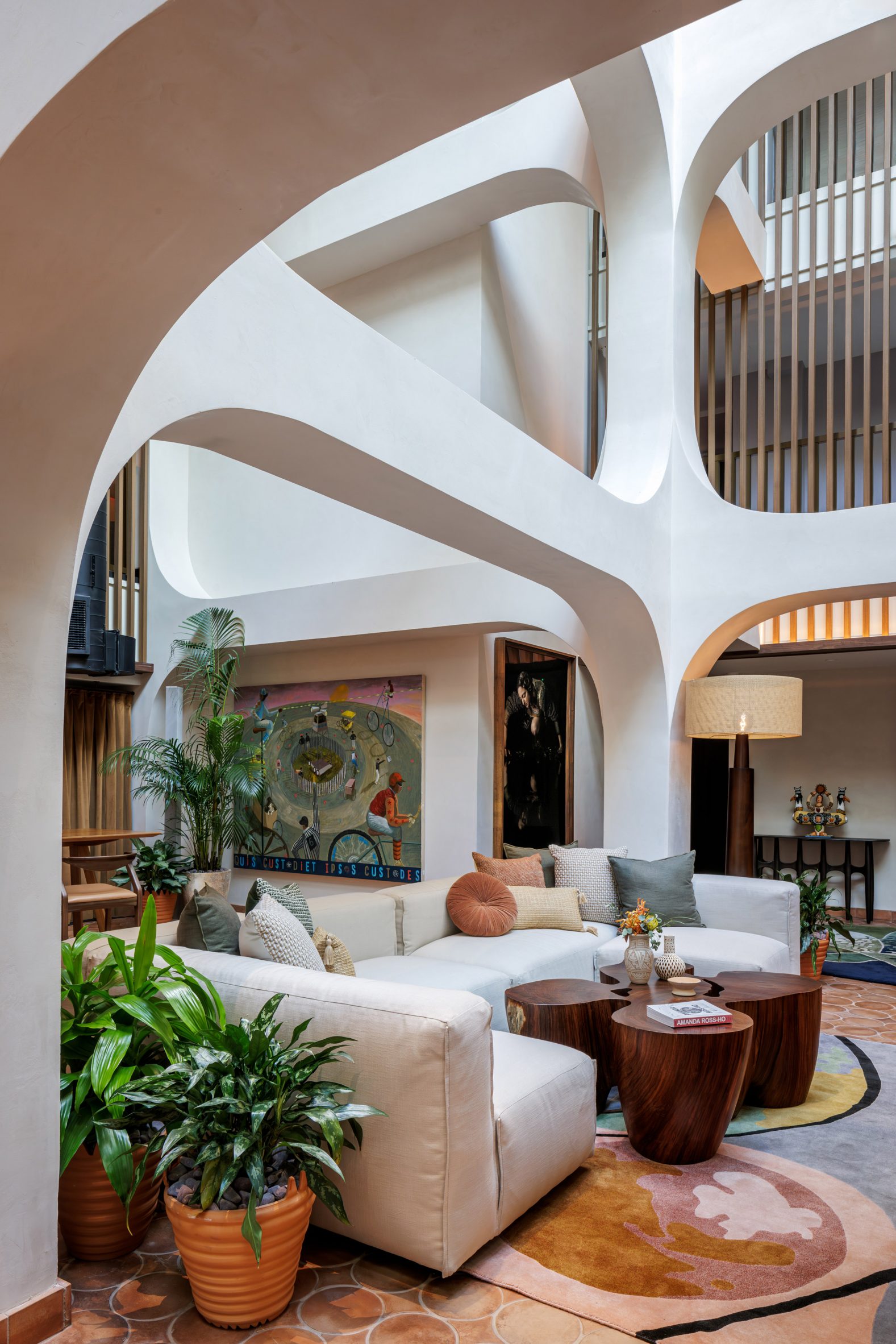 Lounge area under rounded arched columns and beams