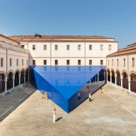 Una/Unless installs glossy prismatic pavilion in historic Venetian courtyard