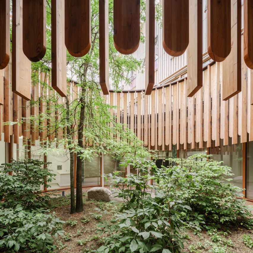 triple house by superhelix unfolds three successive gabled units clad in red cedar