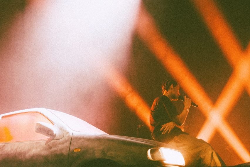 Person sitting on car