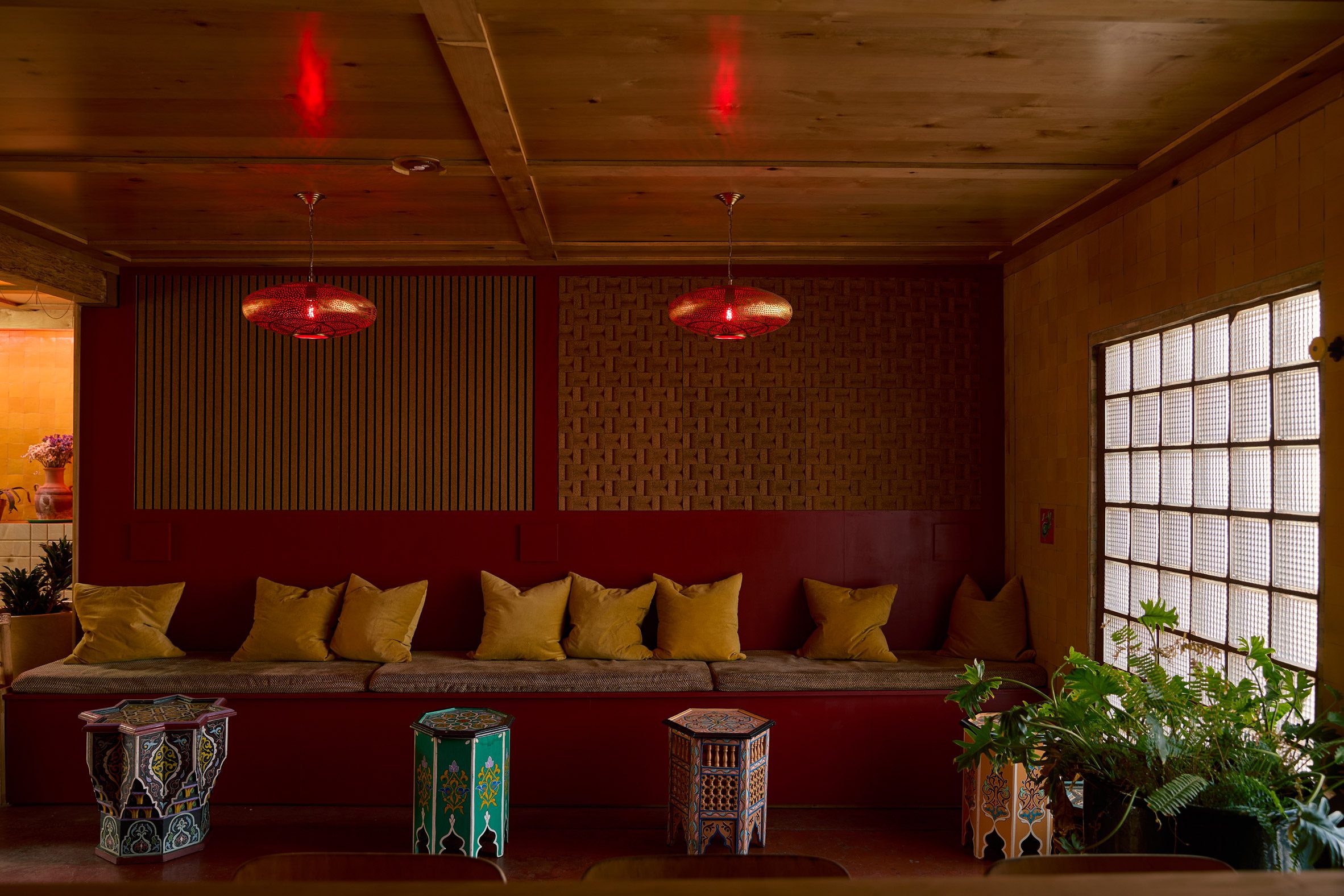 Bar with built-in seating and decorative Moroccan tables