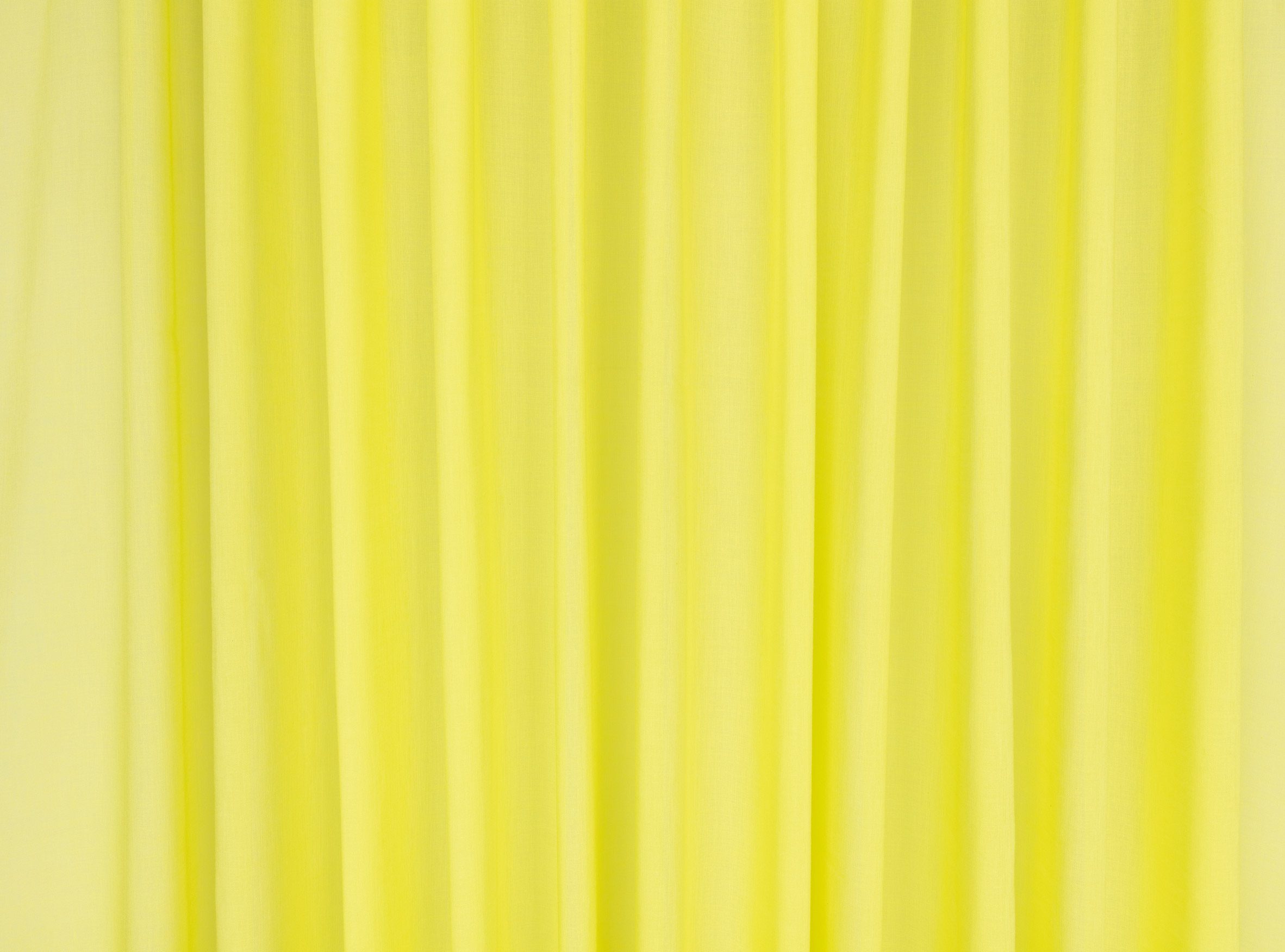 Close-up photo of the Kirkby Design Aloe fabric in a bright acid yellow