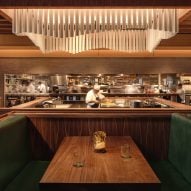 Michael Hsu fills Houston seafood restaurant with dark wood and green accents