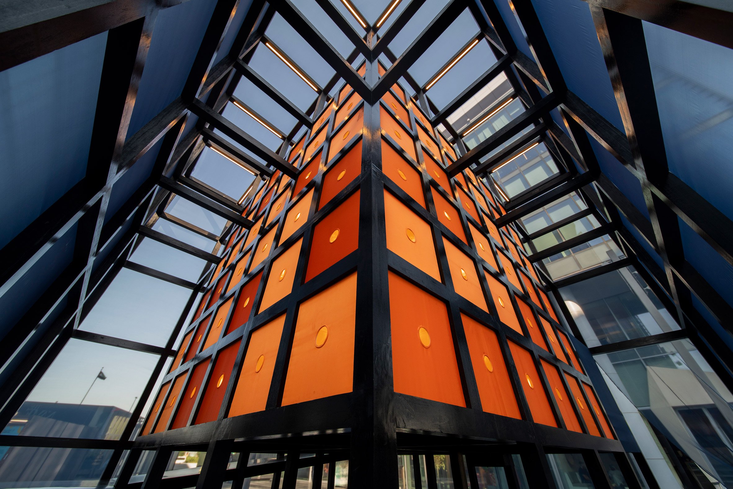 Orange cube within Luxury of Less pavilion at Dubai Design Week 2024