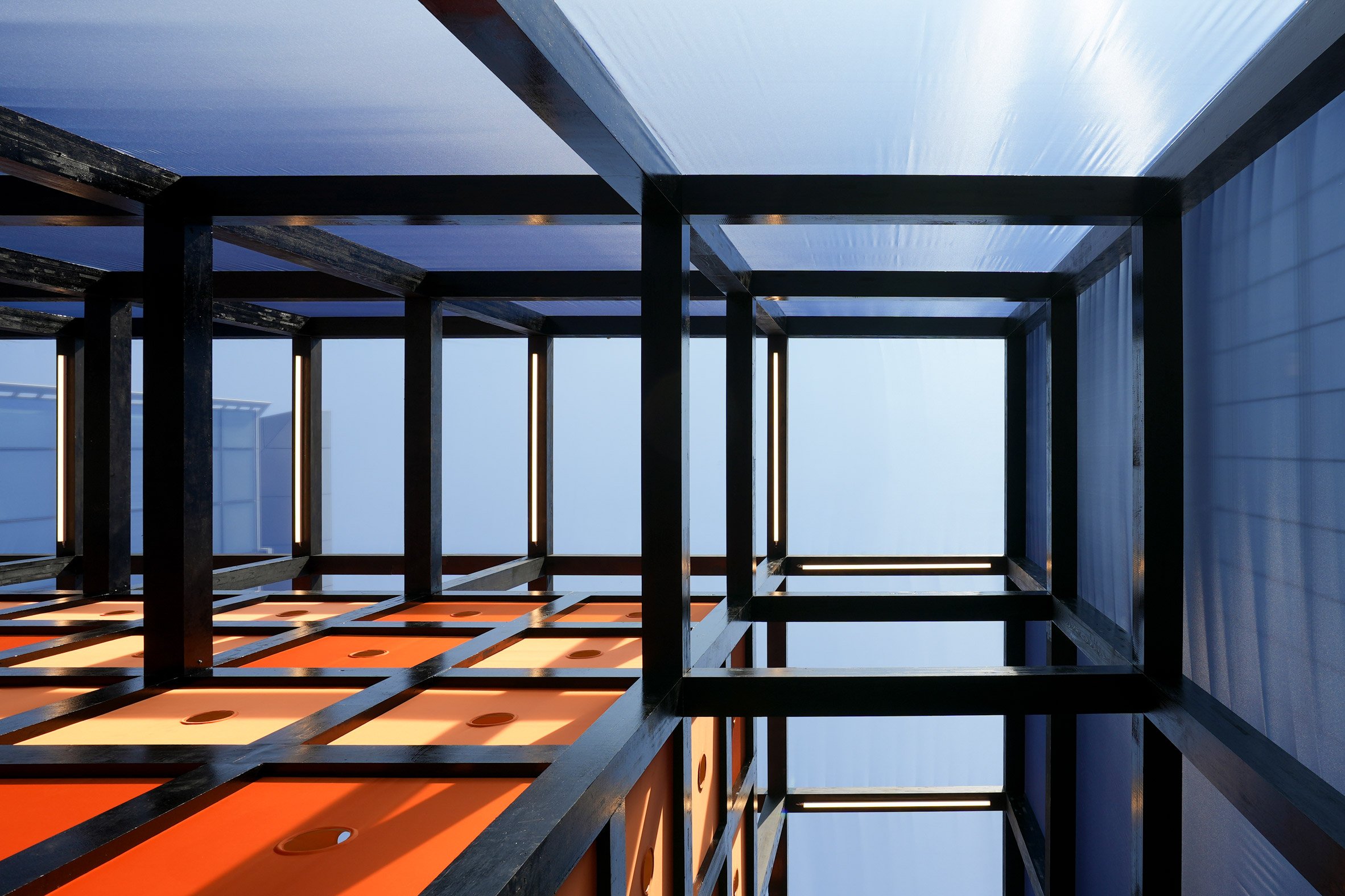 Upward shot of a timber framing system clad in fabric