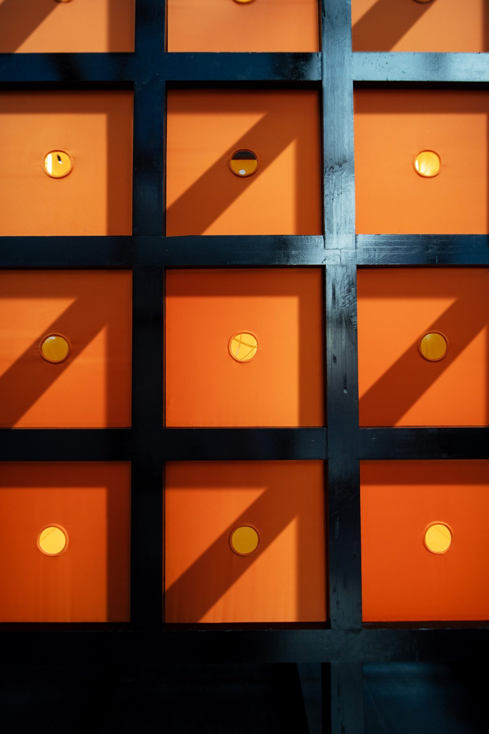 Orange squares in a black timber grid