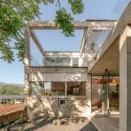 Chaoffice fills concrete grid with reclaimed stone for home in rural China