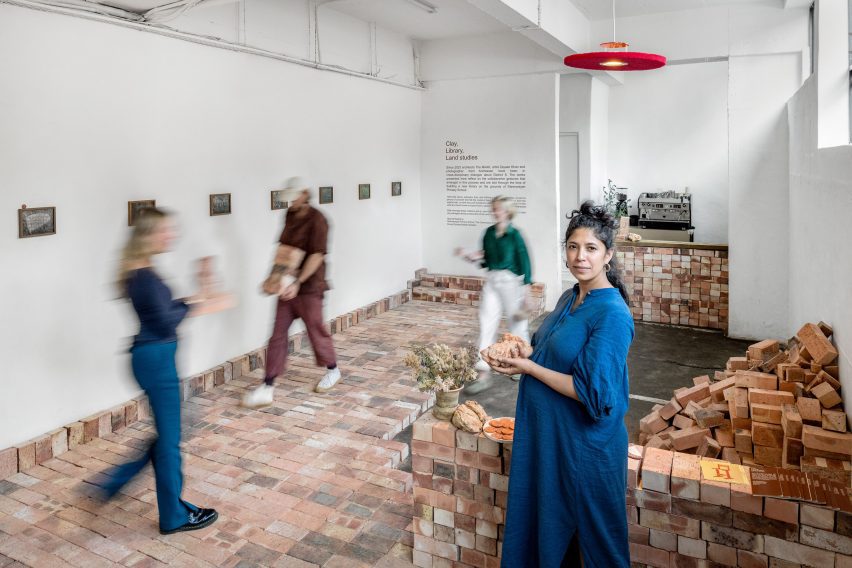 Photo of artists and visitors in the Clay, Library, Land Studies exhibition in Cape Town