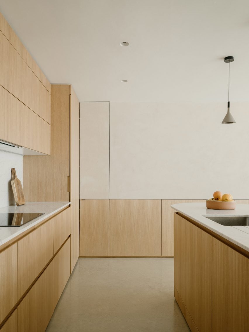 Kitchen interior within Datum House by DHaus