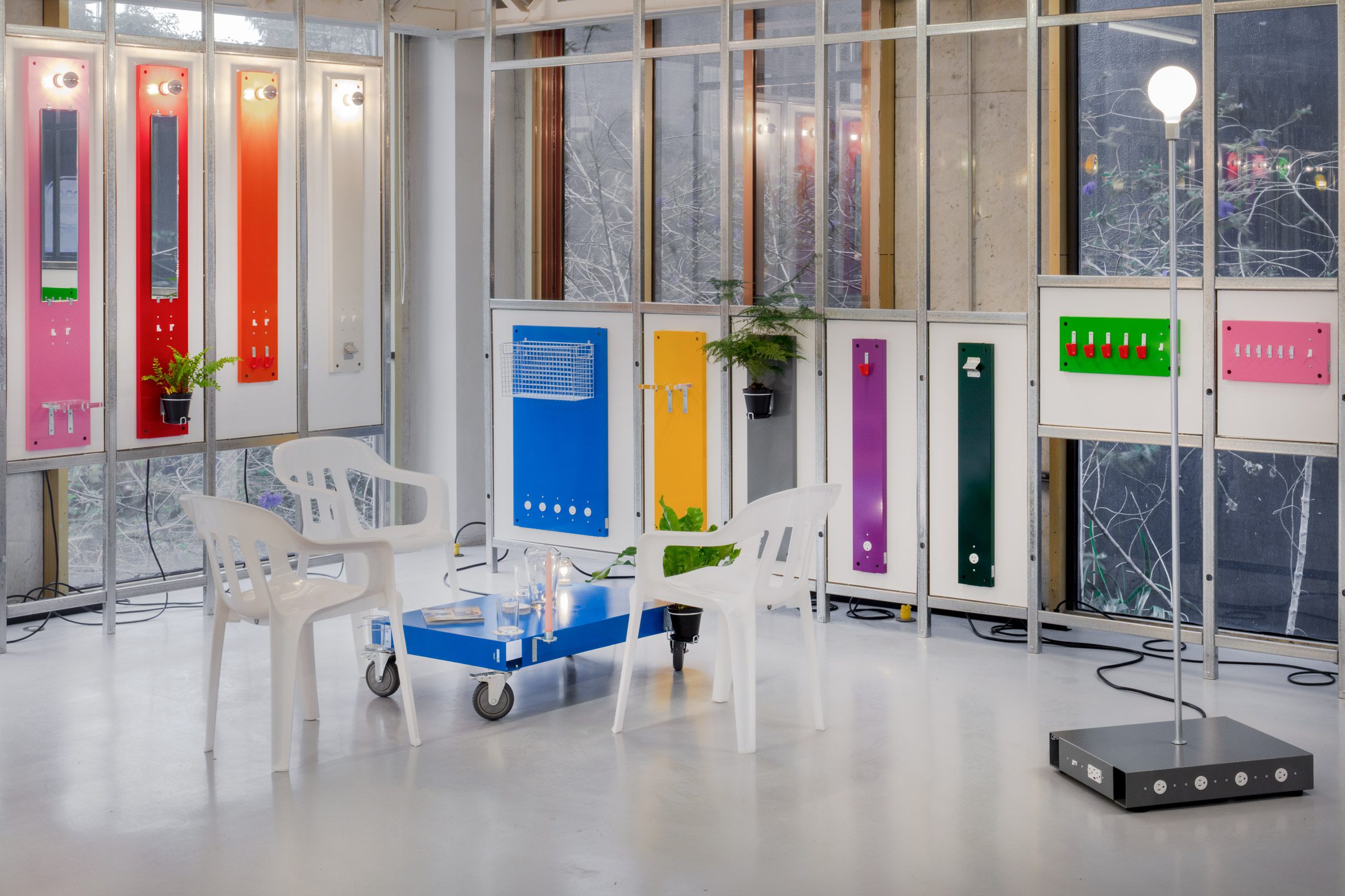 Colourful table with accessories attached with suspended wall accessories