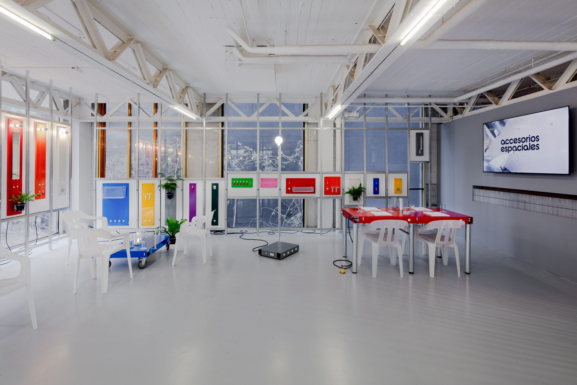 Colourful furniture in white gallery