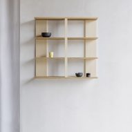 Wooden shelf on white wall