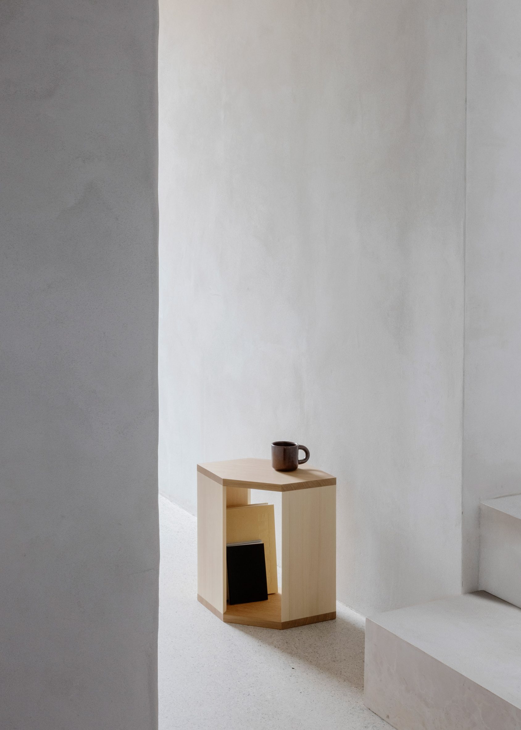 Wooden side table in a minimalistic room