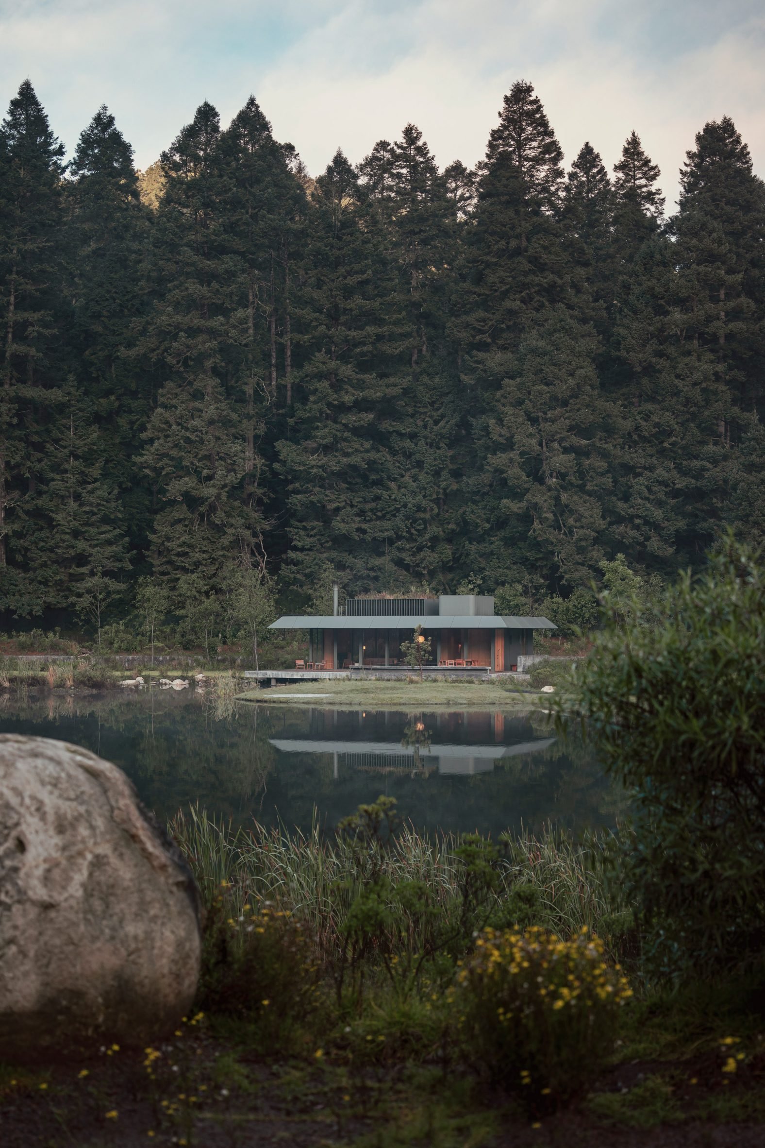 Lakeside steel structure viewed from across water