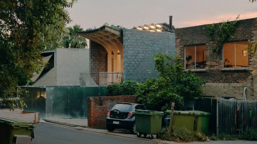 Curved roof house Melbourne besides bins