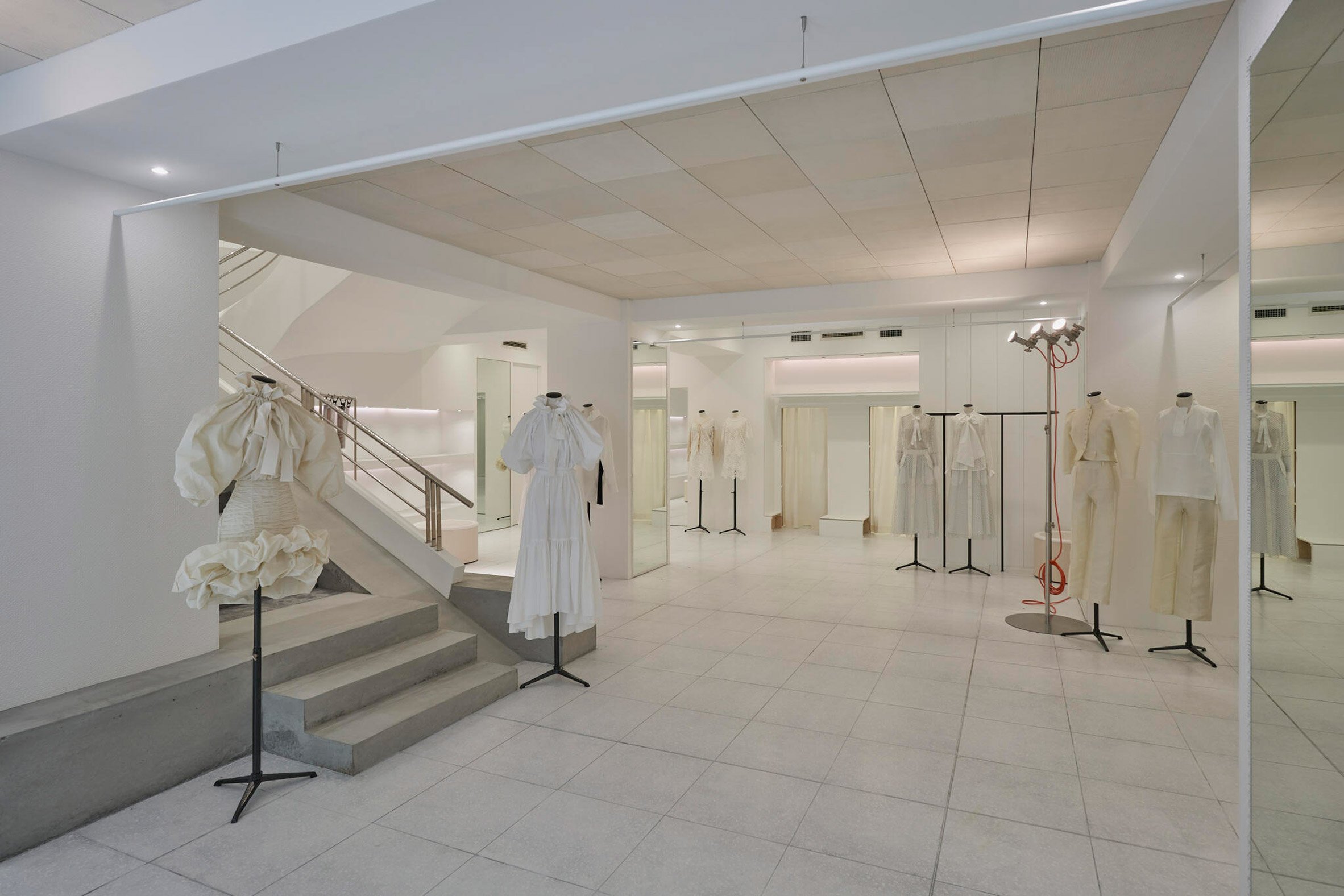 Clothes displayed inside boutique by Shogo Onodera