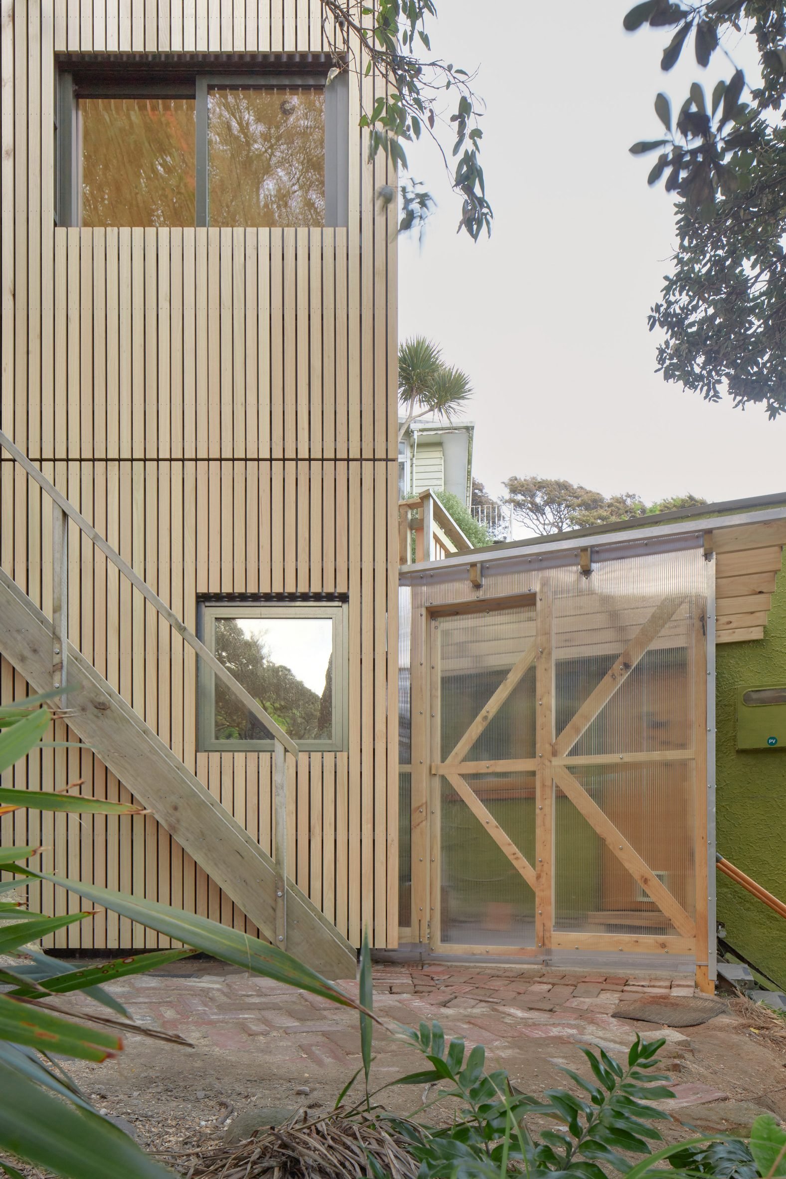 Polycarbonate- and wood-clad home