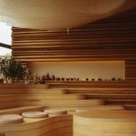 Kengo Kuma designs London sushi restaurant with undulating wooden bench