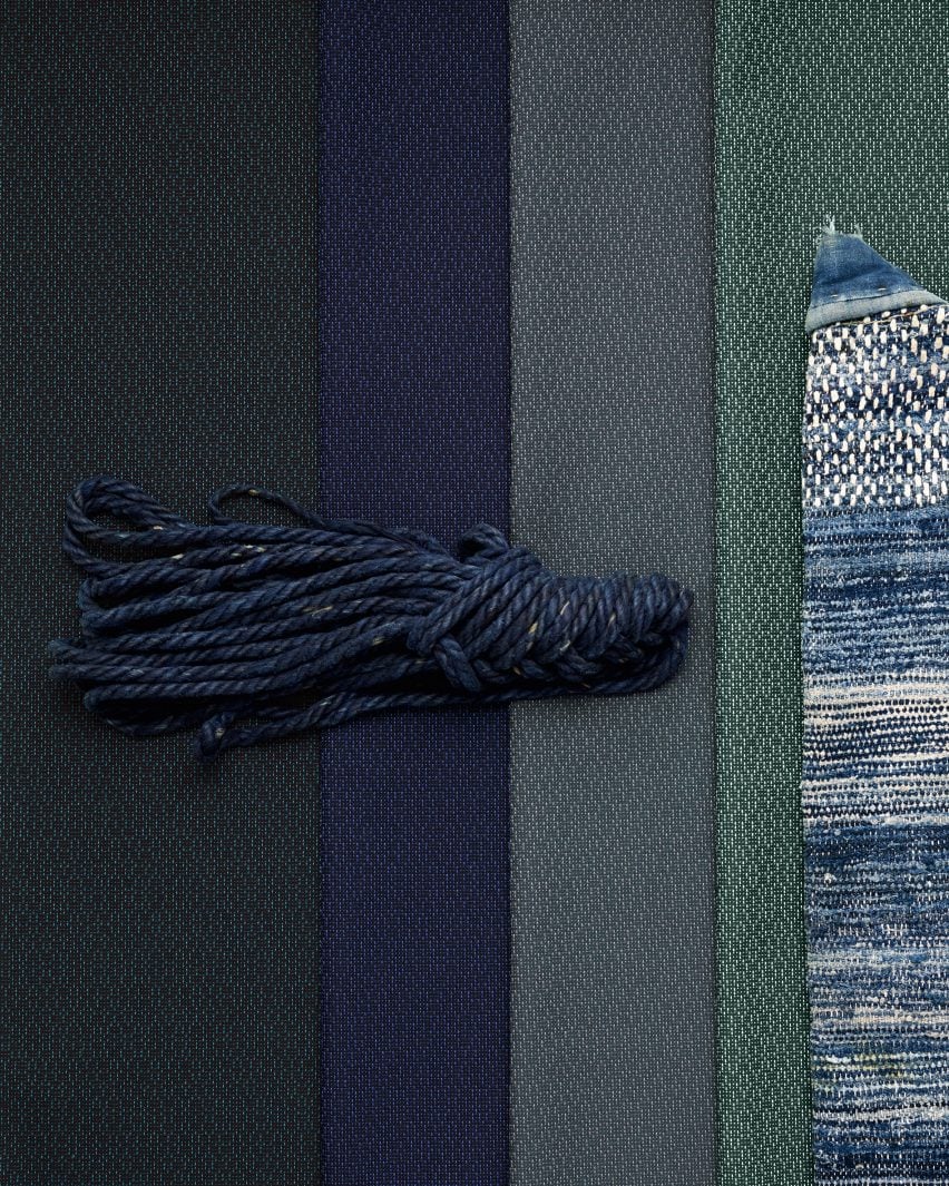 Flatlay image of several samples of Ame textile in greens and blues with a complementary tassel on top