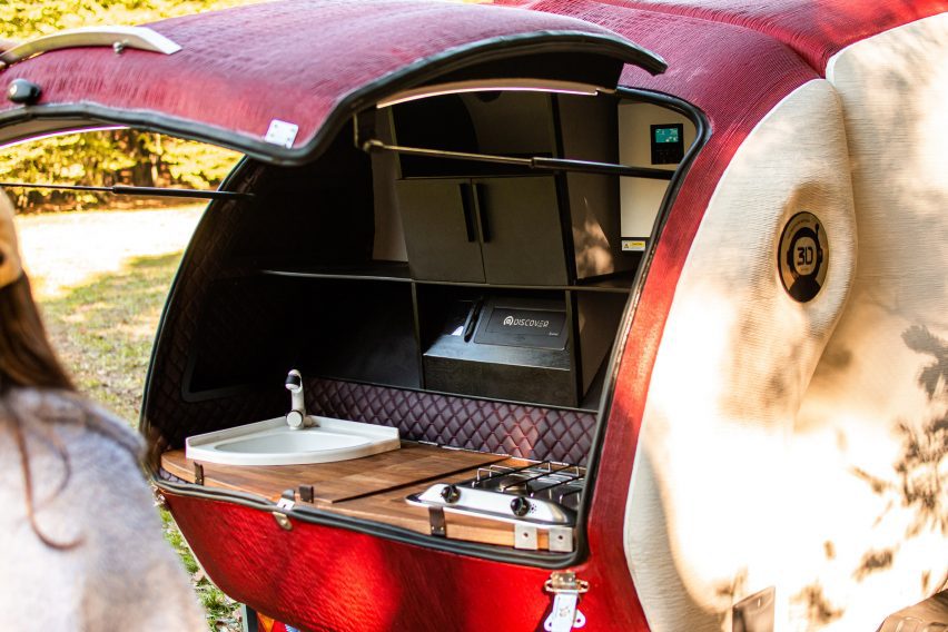 Kitchenette in a red camper