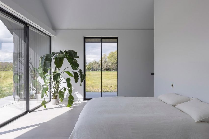 Bedroom interior within countryside home by Mailen Design and Peter Bradford Architects