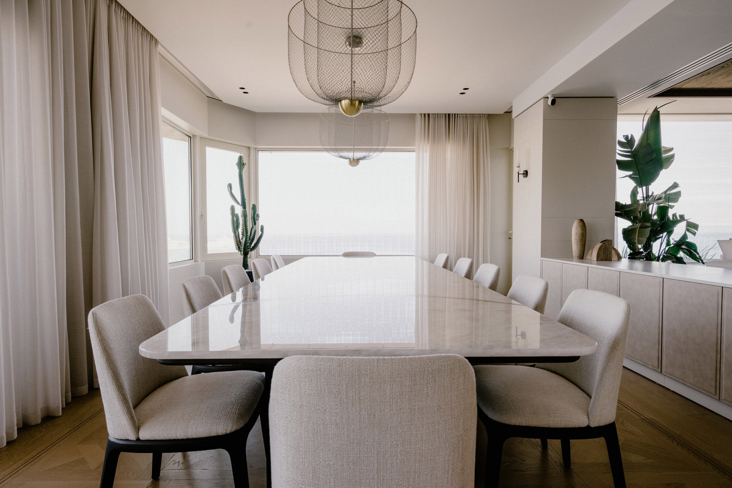 Long white stone table overlooking sea