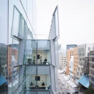 SOM covers computing college at MIT in large glass shingles